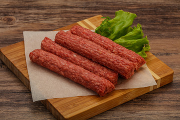 Raw beef sausages with spices