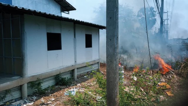 Fire burn abandoned house. Destruction by Surface Fire while dry season. Footage 4k