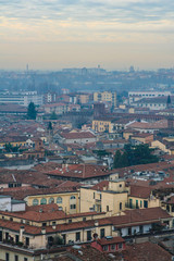 interesting view of verona from above with the bell towers and houses in the background
