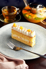 Piece of cake with pineapple and whipped cream.