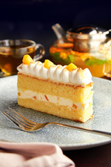 Piece of cake with pineapple and whipped cream.