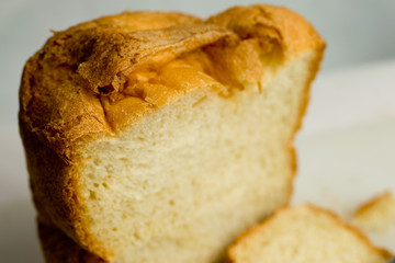 Fresh white loaf of bread with golden crust
