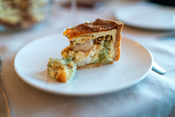 Broccoli egg cheese casserole in baking dish on concrete background