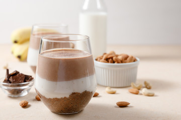 Chia seeds pudding with chocolate and banana smoothie in a glass