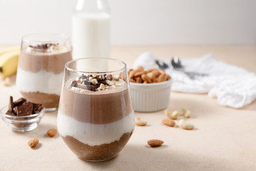 Fototapeta na wymiar Chia seeds pudding with chocolate and banana smoothie in a glass