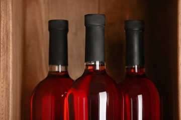 Bottles of wine in cellar, closeup