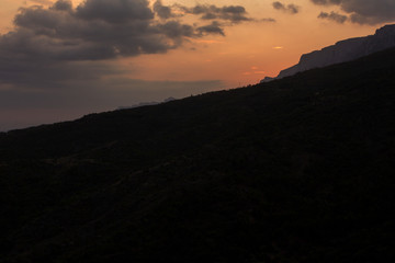 Sunset view of a mountain, clouds. Simeiz, Crimea.