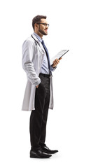 Young male doctor holding a clipboard