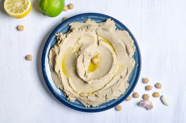 hummus on white kitchen table