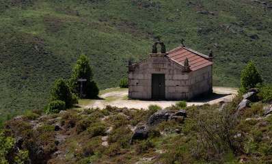 The "Santa Luzia" Mountain Chapel, near of the famous "Cela Cavalos" waterfall in Geres National Park, Braga, Minho, Portugal.