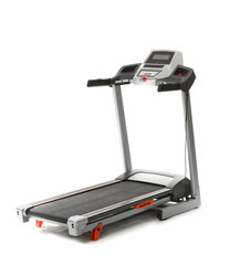 Modern treadmill on white background