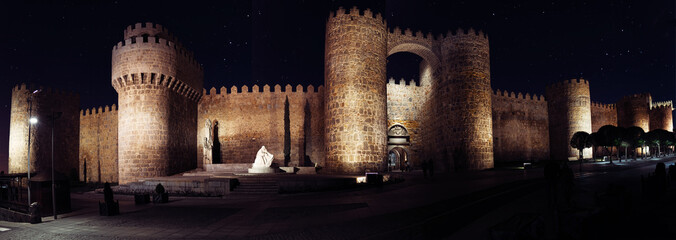 NIght panorama of the 14th century romanic medieval walls of Avila (Spain).  Vista nocturna de las murallas de Avila.
