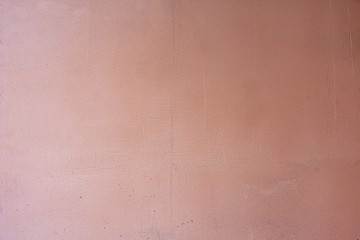 old concrete wall painted in light burgundy color