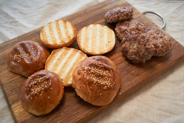 Fresh homemade burger buns with sesame seeds.