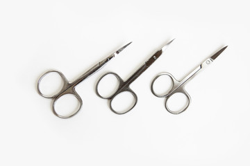 metal scissors for manicure and pedicure on a white background