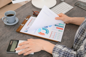 Female accountant working in office, closeup