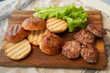 Fresh homemade burger buns with sesame seeds.