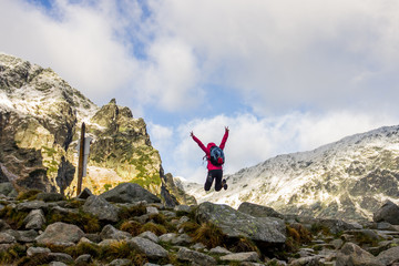 Young girl jumps in the Polish mountains