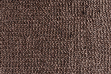 Fototapeta premium Knitted texture of brown color.