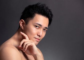 Fototapeta na wymiar Closeup of attractive young asian man face