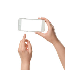 Female hands with mobile phone on white background