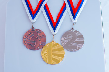 Gold medal on white background. White edit space