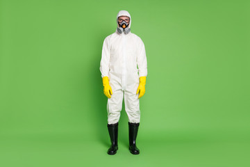 Full length body size view of his he nice serious expert workman wearing gas mask white sterile costume sars ncov n-cov-2 defense public place isolated over green pastel color background