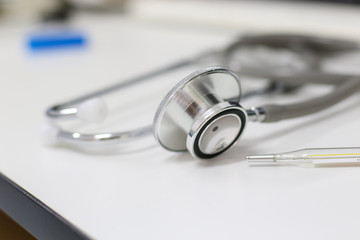 Stethoscope isolated equipment on white texture with blurred background