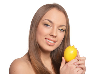 Portrait of beautiful young woman with lemon