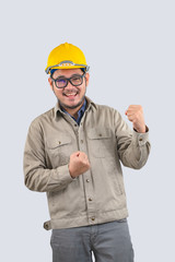 Young computer engineer asian man raise fists and fight