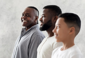 Three Generations Of Men. Happy Black Granddad Looking At Son And Grandson