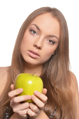 Close up portrait of beautiful young woman with green apple