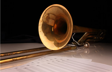 Trombone on a white glossy table