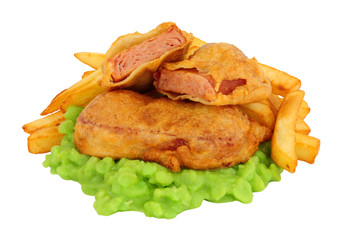 Spam fritters and chips meal with mushy peas isolated on a white background