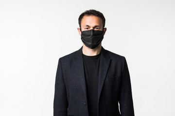 Young businessman is trying on a medical mask in the midst of a coronavirus pandemic isolated on white background