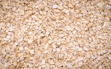 Natural oatmeal flakes, healthy food ingredients with vitamins.