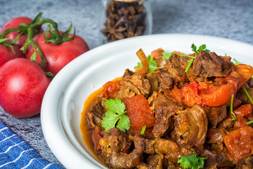 Chili con carne - in American English as simply chili, is a spicy stew containing chili peppers, meat (usually beef), tomatoes and often beans