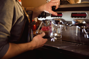 close up barista hand making a cup of coffee