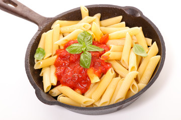 pasta with tomato sauce and basil in casserole