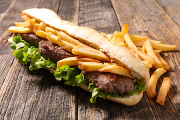 american sandwich- baguett with beef steak and french fries