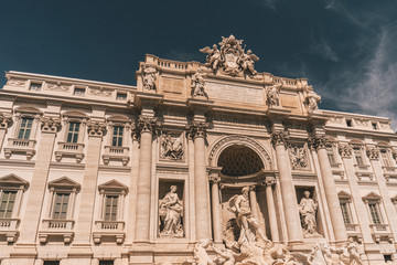 fontana di trevi in rom with blue sky and summer vibes