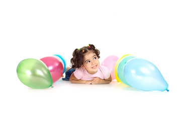 Cute girl with balloons on a white background