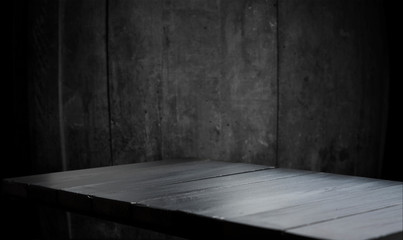 Wooden table with dark blurred background design