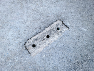 High Angle View of Rain Water Drainage Holes on the Road