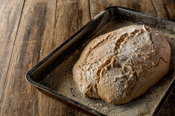 homemade handmade bread on wooden background