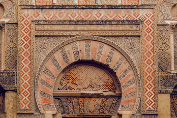 Design of the ancient gate Puerta de San Esteban in traditional style, carved walls of the Mezquita, Mosque-Cathedral of Cordoba, Spain