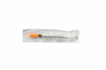 disposable plastic syringe with needle in package isolated on white background