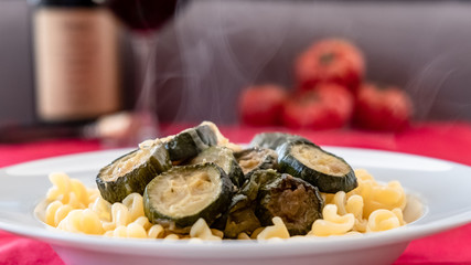 Italian food: pasta with zucchini and parmesan