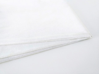White cotton fabric texture isolated. Folded white cotton fabric. White Pattern and background.