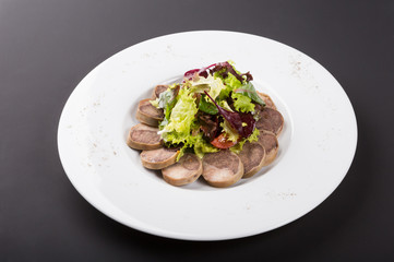 Sliced homemdae sausage on a plate